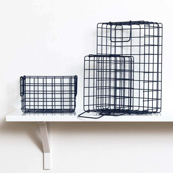Set of navy metal wire baskets for all for bits and bobs, designed to fit inside lockers and maximize storage.