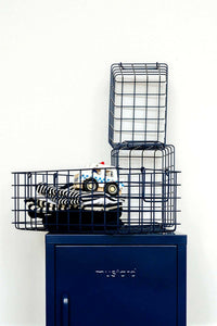 Set of navy wire baskets for all for bits and bobs, designed to fit inside lockers for versatile storage.
