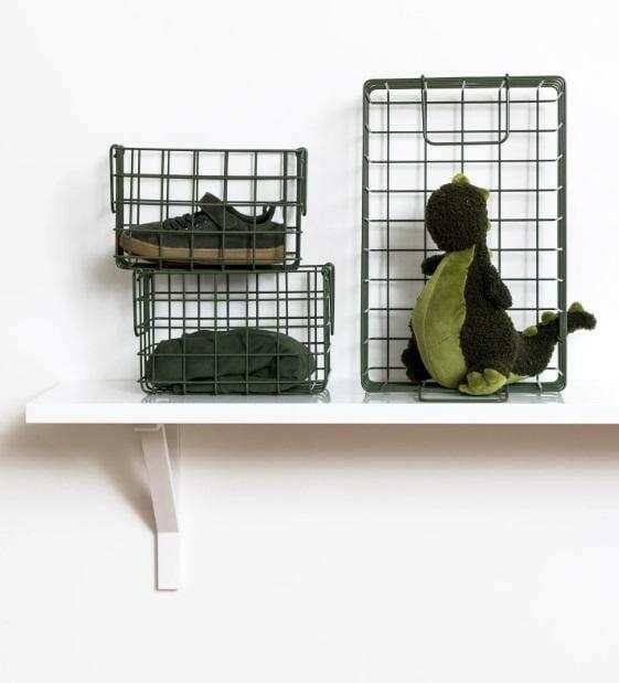 Set of three olive baskets in different sizes for locker storage, including one large and two small wire baskets on a white shelf