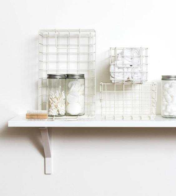 Set of chalk baskets in creamy white for organized storage on a shelf