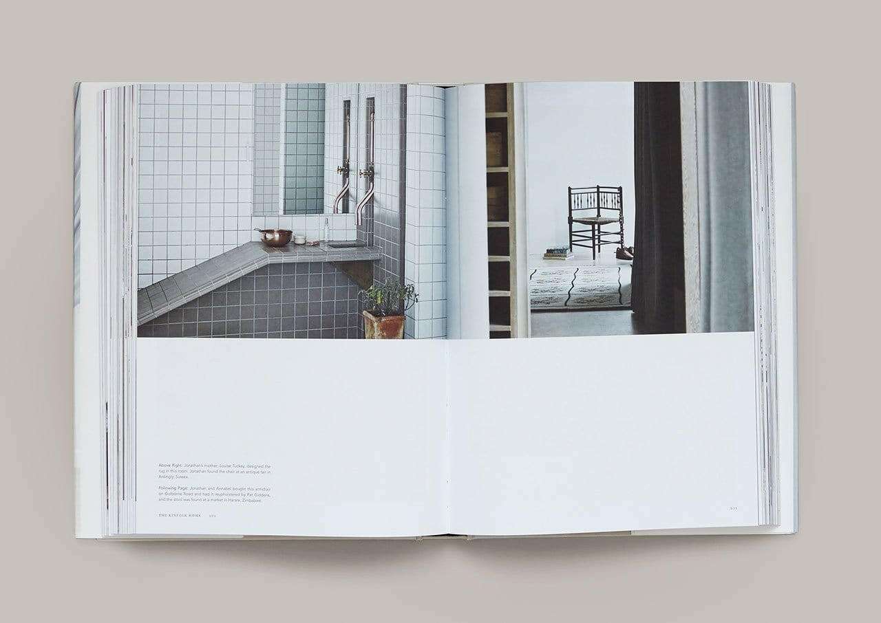 Open book showing interior photography and minimalist home design from The Kinfolk Home book by Nathan Williams