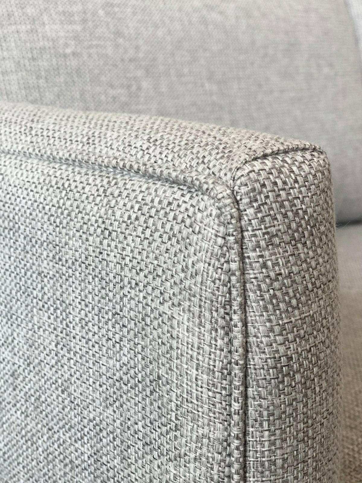 Close-up of a 2.5 seater Custom Norsu Sofa upholstered in durable Wells Driftwood fabric with detailed textured weave.