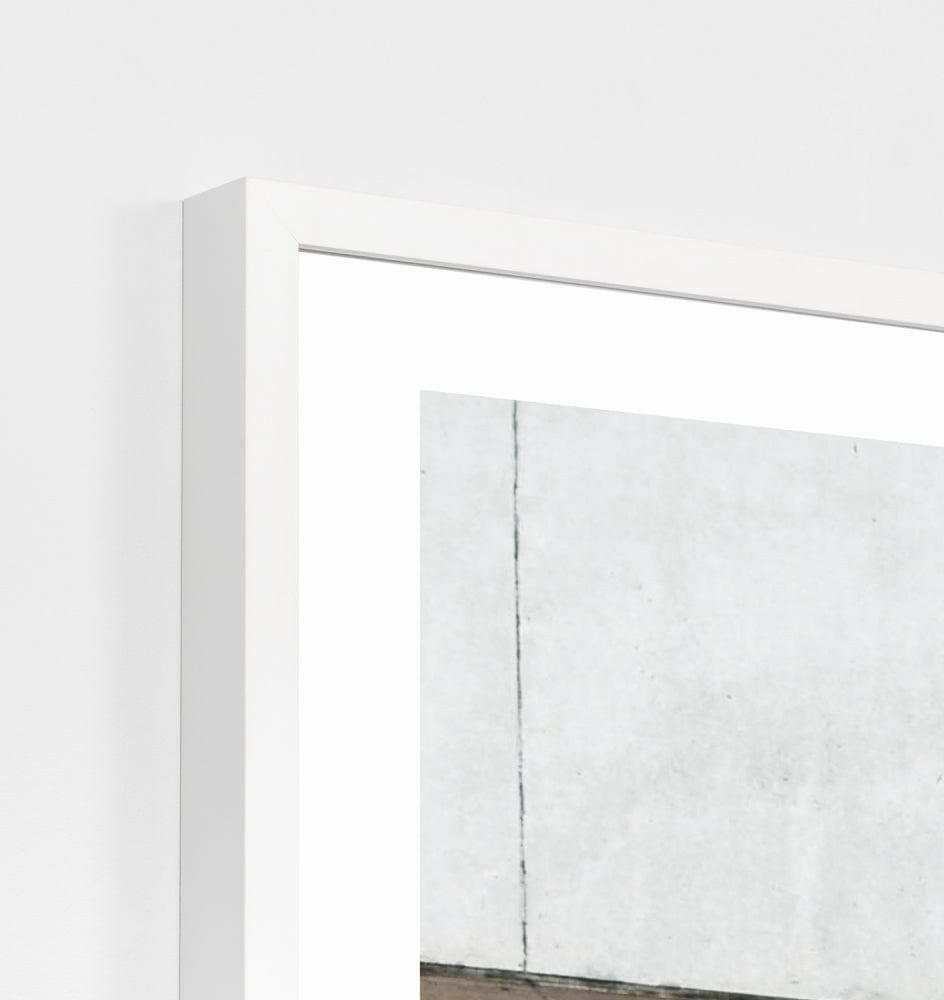 Framed minimalist photographic print titled Middle Of Nowhere 'Walkway' in a white frame behind glass, measuring 81 x 101cm.