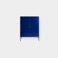 Navy blue Mustard Made Locker with double doors, handles, locks, vents, and elevated legs for versatile storage.