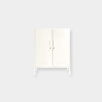 Mustard Made Locker The Midi in soft chalk color with double doors, handles, locks, and adjustable shelves for versatile storage.