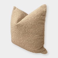 norsu Studio Bouclé Buff cushion with white leather piping, textured throw pillow in neutral tones