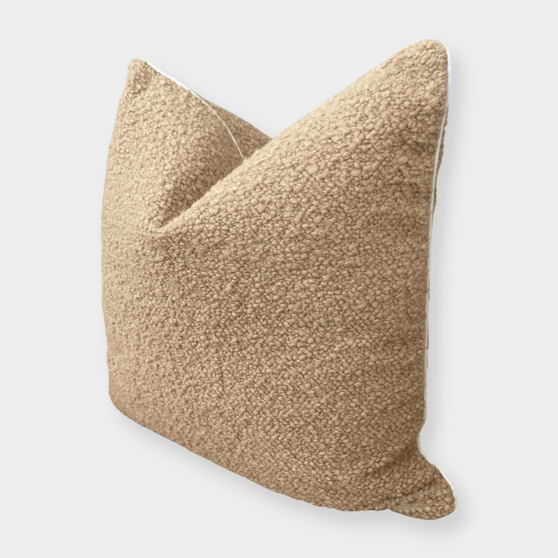 norsu Studio Bouclé Buff cushion with white leather piping, textured throw pillow in neutral tones